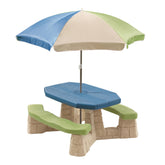 Step2 Naturally Playful Picnic Table with Umbrella provides shade for sunny outdoor meals.
