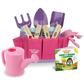 The Storybook Kids Explorers Club pink tote bag keeps tools organized for outdoor play.