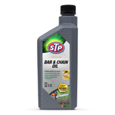 STP Premium Bar and Chain Oil bottle pour shows ready-to-use formula protecting bar and chain
