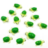 Suartus mini green turtle figurines in a fairy garden display.