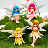Suartus miniature fairy figurines in four colors for fairy garden displays.