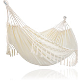 SUNCREAT portable camping hammock in beige tassels for easy outdoor relaxation.
