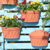 Sungmor brick-red wall-hanging planter front view for balcony décor.