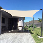 Sunny Guard sun shade sail closeup shows UV-blocking fabric in butter cream