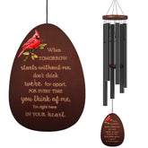 Suntimber memorial wind chimes outdoors with cardinal design for garden remembrance.