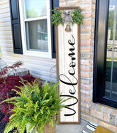 Surfapans welcome sign on wood frame enhances porch curb appeal