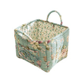 Sylet quilted fabric storage basket with floral pattern for stylish home organization.