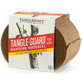 Tanglefoot Tangle-Guard tree wrap unrolled on trunk for bark protection against insects
