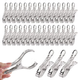 Tanstic greenhouse clamp with a 3-5 inch opening secures netting and film.
