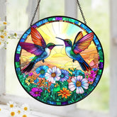Tatkuink hummingbird suncatcher in a sunny window showing colorful light display