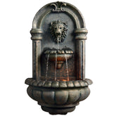 Teamson Home Lion Head Wall Fountain front view with warm LED glow for evening ambiance.