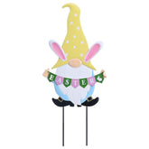 TERESA'S COLLECTIONS Easter gnome stake pink hat greets guests in outdoor spaces.