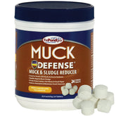 The Pond Guy Muck Defense tablets dissolving to digest pond sludge.