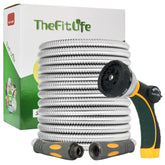 TheFitLife metal garden hose in use watering a flower bed with steady flow.