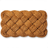 THEODORE MAGNUS coir rope knot design door mat enhances entry and dirt trapping.