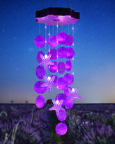 Toodour solar wind chimes with purple shells illuminate your outdoor space.