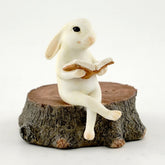 Top Collection bunny reading on stump statue enhances cozy shelves and fairy garden scenes.