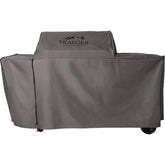 Traeger BAC776 all-weather cover protecting Woodridge Pro from rain and sun
