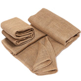 TravLand burlap roll in garden beds for weed control.