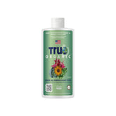 True Organic Liquid All-Purpose Plant Food bottle pour supports easy feeding.