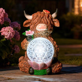 TSTGEE Highland Cow with LED ball light, perfect for ambient garden glow.