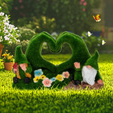 Twinbling heart-shaped moss gnome statue adds festive outdoor charm