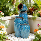Ultym four-tier ceramic fountain with turquoise glaze forms a striking outdoor centerpiece
