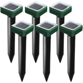 USKICH solar mole-repellent spike installed in garden deters burrowing pests.