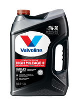 Valvoline High Mileage 150K bottle pouring to reduce oil consumption.