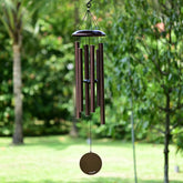 Vanquer wind chimes outside with deep tone and 38-inch presence for garden ambience.