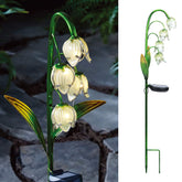 VCUTEKA solar garden stake with glass flower glowing at dusk for yard ambience