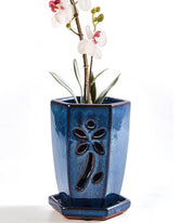 vensovo 4-inch ceramic orchid pot with holes and saucer in blue for drainage.