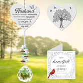 Vetbuosa memorial crystal suncatcher hanging in a window casting soft rainbows
