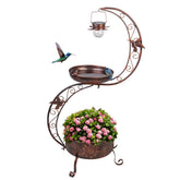 VEWOGARDEN bird bath outdoors with solar lamp glowing softly at dusk