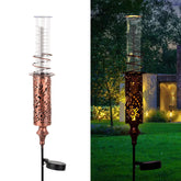 VEWOGIFT rain gauge with solar LED stake lit in garden for ambient lighting and measurement