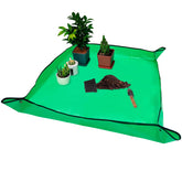 VinYankee repotting mat lies flat on a worktable for mess-free planting.