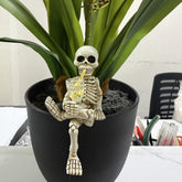WACSLDN skeleton flowerpot decoration in yellow cup adds whimsy to outdoor spaces.