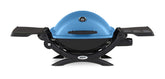 Weber Q1200 blue hood in portable setup for travel grilling.