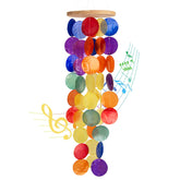 WeDoSoy windchimes outside with rainbow capiz shells for soothing coastal ambience