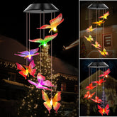 WENANA solar wind chimes with purple butterfly illuminate outdoor spaces at night.