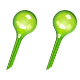 WHTCHSU water globes in green provide steady moisture release for indoor plants.