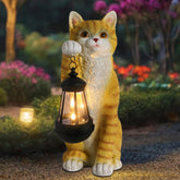Wonder Garden solar cat statue with lantern lights outdoor spaces at night.