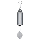 Woodstock Chimes Heroic Windbell 24-inch silver in sunlight provides a soothing outdoor ambience.