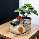 Wsmart gnome planter on a shoe adds playful curb appeal.