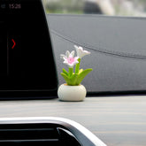 YGMONER lily flowerpot dashboard decor enhances car interior with a delicate resin bloom.