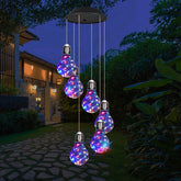 YHmall colorful solar wind chimes illuminated at dusk for ambient outdoor lighting.