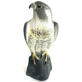 YOFIT Horned Hawk Decoy perched to deter garden birds effectively.