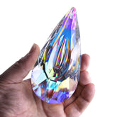 YU FENG 120mm crystal prism suncatcher in sunlight casts vivid rainbows on a window
