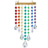 YU FENG 12-inch hanging crystal prism suncatcher creating rainbow light.