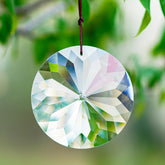 YU FENG Bauhinia crystal suncatcher 85mm round casting colorful rainbows in sunlight.